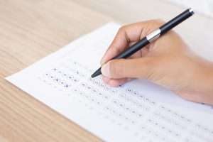 closeup-person-filling-out-questionary-form-1024x683